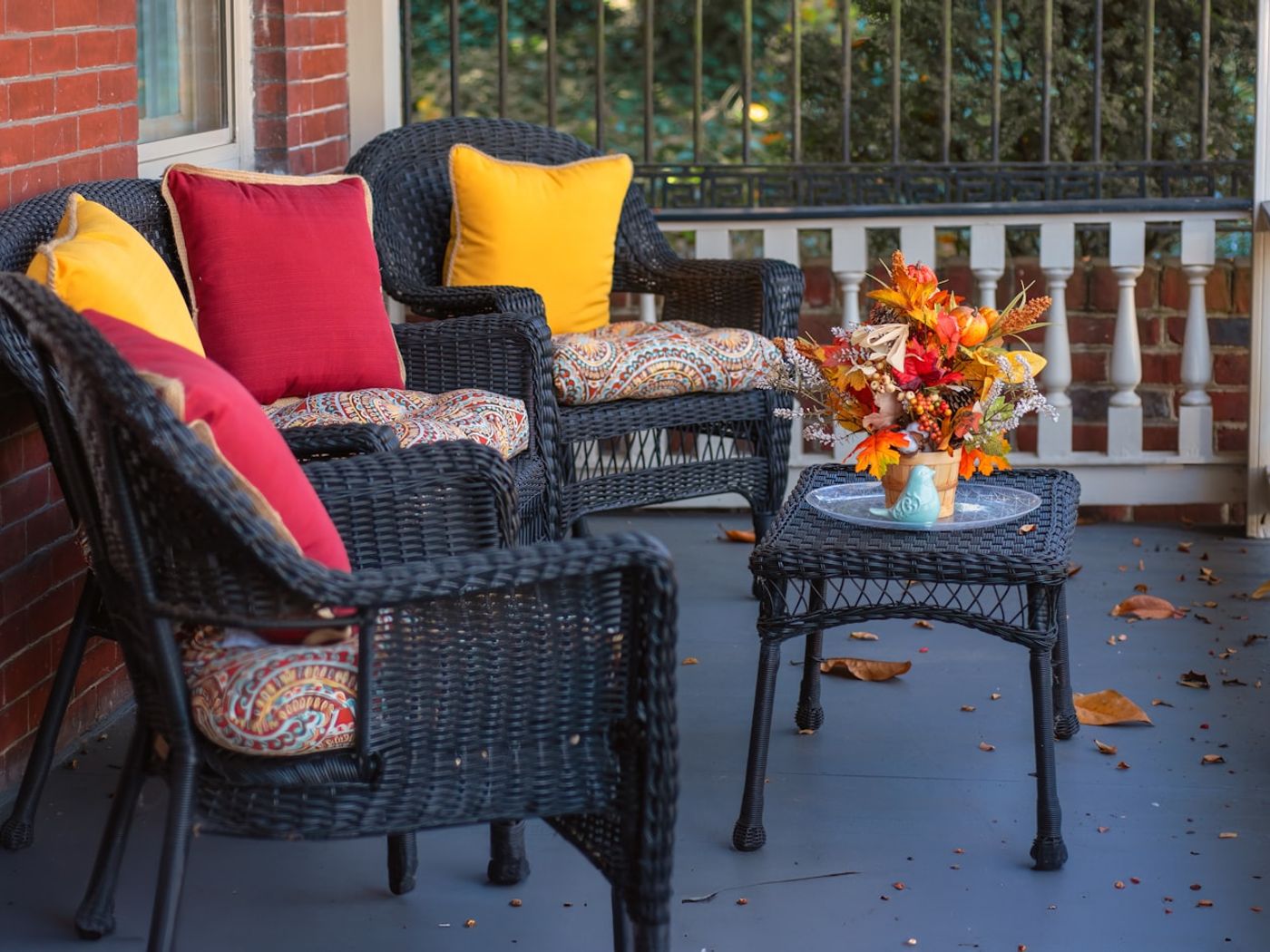 A welcoming front porch with chairs and an open door